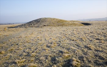 Bronze Age bowl barrow on Windmill Hill, a Neolithic causewayed enclosure, near Avebury, Wiltshire,