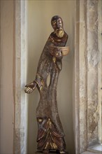 Church of Saint Andrew, Wissett, Suffolk, England, UK artwork sculpture of St Andrew by Peter Ball