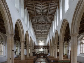 Interior view down nave to chancel with wooden roof, Holy Trinity church, Blythburgh, Suffolk,