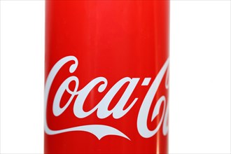 Close-up of a Coca-Cola can against a white background