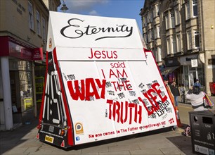 Large mobile Christian religious advertising boards in town centre street, Chippenham, Wiltshire,