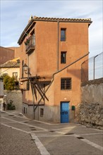 Historic building house ochre orange colour, in old part of city of Cuenca, Castille La Mancha,