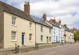 A row of Georgian stone cottages in in the Saxon town of Cricklade, Wiltshire, England, UK