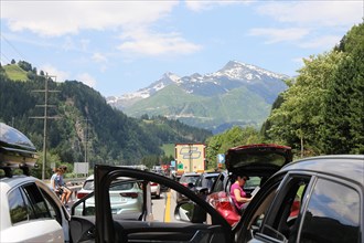 After an accident in the Gotthard tunnel in Switzerland, a long traffic jam forms in front of it