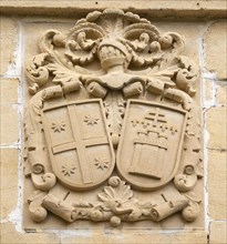Stonework detail of coat of arms on wall of building, village of Elceigo, Alava, Basque Country,