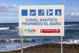 Sign prohibiting bathing swimming in boat channel, Las Negras, Cabo de Gata Natural Park, Nijar,