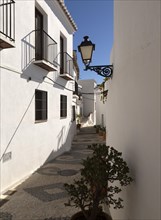 Traditional pueblo blanco narrow streets whitewashed houses, village of Frigiliana, Axarquia,
