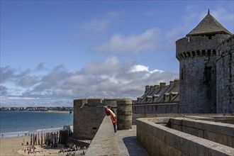 Tourists on the city wall of Saint Malo, Brittany, France, Europe