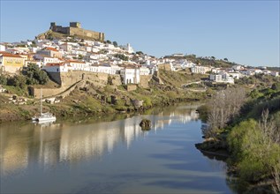 Historic hilltop walled medieval village of Mertola with castle, on the banks of the river Rio