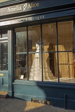 Wedding dress in shop window Amelia and Alci bridal boutique shop, Market Hill, Woodbridge,
