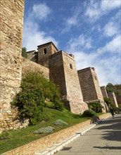 Historic walled defences to Moorish citadel fortress palace of the Alcazaba, Malaga, Andalusia,