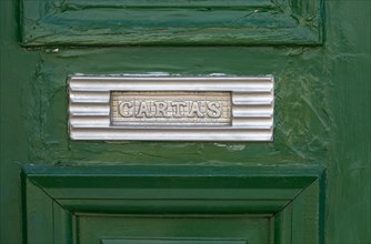 Close up of traditional style letterbox on front door of house in Evora, Alto Alentejo, Portugal,