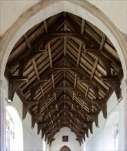 Historic interior of Bedingfield church, Suffolk, England, UK wooden hammer beam roof