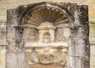 Historic carved stonework of water fountain in village of Laguardia, Alava, Basque Country,