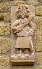 Stone carving sculpture mounted on wall in village of San Vicente de la Sonsierra, La Rioja, Spain,