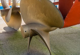 Closeup of large metal propeller on retired frigate on display at public park in Seosan, South