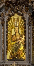 Ornately decorated statue of Blessed Virgin Mary 17th century church of Igreja de Santiago, Tavira,