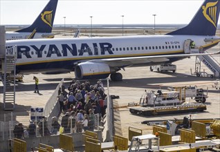 Passengers held back people waiting to board a Ryanair plane flight Faro airport, Portugal, Europe