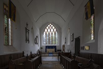 Interior village parish church of Saint Peter, Westleton, Suffolk, England, UK east window and