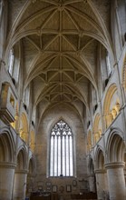 Vaulted roof celing with carved stone bosses inside Malmesbury abbey church, Wiltshire, England, UK