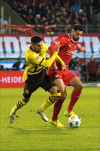 Football match, Emre CAN Borussia Dortmund in a duel with Tim KLEINDIENST 1.FC Heidenheim, football