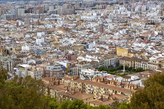 Cityscape view go high density buildings in city centre of Malaga, Spain, Plaza de Merced lower