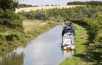 Narrowboats on the Kennet and Avon canal near Crofton, Wiltshire, England, UK