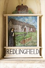 Old village painted sign in porch of Redlingfield church, Suffolk, England, UK, depicting Nun and