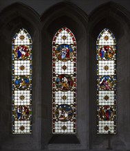 Stained glass in north transept window depicting biblical scenes by Clayton and Bell, undated, in