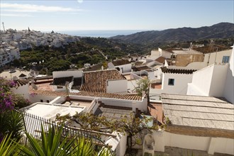 Rooftops of traditional pueblo blanco whitewashed houses in village of Frigiliana, Axarquia,