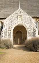 Entrance porch doorway village parish church and churchyard, Saint Mary, Henstead, Suffolk,