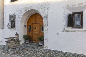 Entrance door, window, historic house, sgraffito, facade decorations, Guarda, Engadin, Grisons,