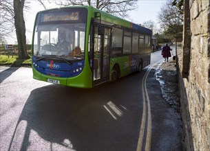 Green single decker service to Marlborough Swindon bus company bus at Avebury, Wiltshire, England,