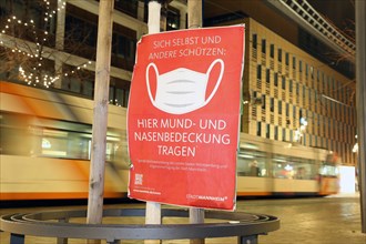 Information board on the obligation to wear masks in Mannheim city centre