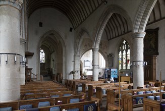 View across the nave to chancel, altar and east window inside the church at church of Saint Mary,