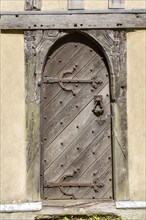 Old wooden door church of All Saints, Crowfield, Suffolk, England, UK