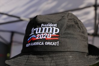 Convinced Trump supporter in Germany wears a cap with the campaign slogan Trump 2020 - keep America
