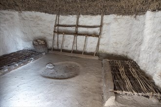 Re-creation of neolithic home, contents, furniture, beds, Stonehenge, Wiltshire, England, UK