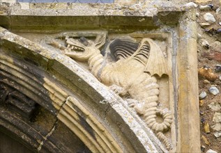 Village parish church Cratfield, Suffolk, England, UK wyvern dragon spandrel stone carving