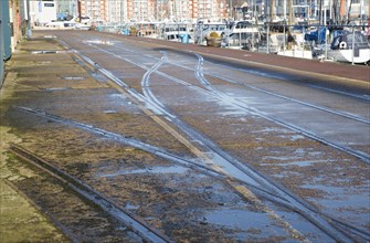 Old rail track lines on quayside Ipswich Wet Dock waterside redevelopment, Ipswich, Suffolk,