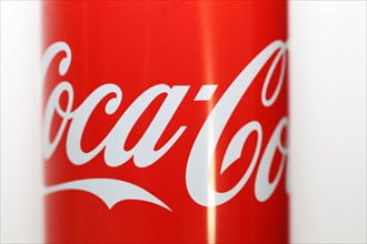 Close-up of a Coca-Cola can against a white background