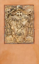 Historic carved stone christian symbols on building frontage, Cuenca, Castille La Mancha, Spain,
