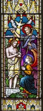 Stained glass window in church of Saint John the Baptist, Badingham, Suffolk, England, UK circa