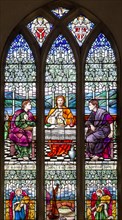 Stained glass east window by M Lowndes c 1920, 'Christ breaking Bread', Snape church, Suffolk,
