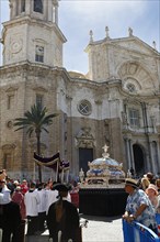 Semana Santa, procession, altar boys follow magnificent coffin, tourists, celebrations in Cadiz,