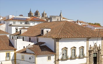 Panoramic style cityscape views over pan tile rooftops and whitewashed buildings in the city centre