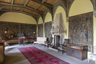 Furniture and wall tapestries in the Morning Room inside Berkeley castle, Gloucestershire, England,