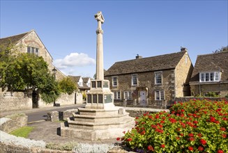 Historic Cotswold stone buildings and war memorial in Canon Square, Melksham, Wiltshire, England,