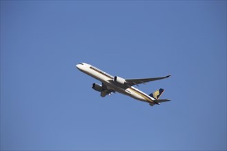 A Singapore Airlines passenger aircraft takes off from Frankfurt Airport