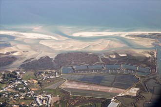 Aerial view of coastline near Faro, Algarve, Portugal showing settlements on coastal plain and